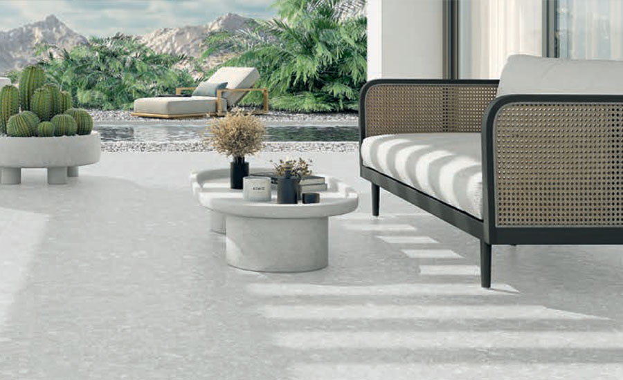A serene outdoor patio featuring reclaimed stone tiles for a durable and eco-friendly design