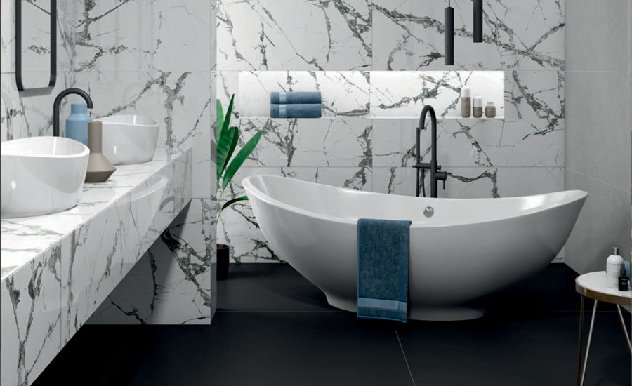A bathroom with black-and-white-marble-effect tiles