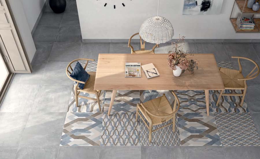 A table with chairs on a beutiful Spanish tile floor