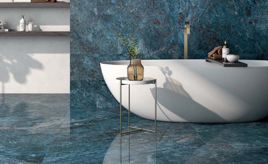 A bathroom with blue tiles on walls and floor